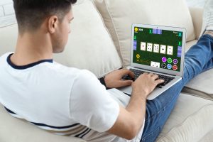 guy playing poker on computer